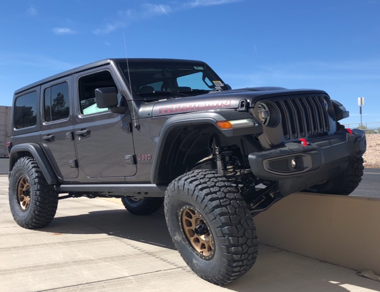 lifted JK Wrangler 2014 Dune color with Atlas bumpers from DSI